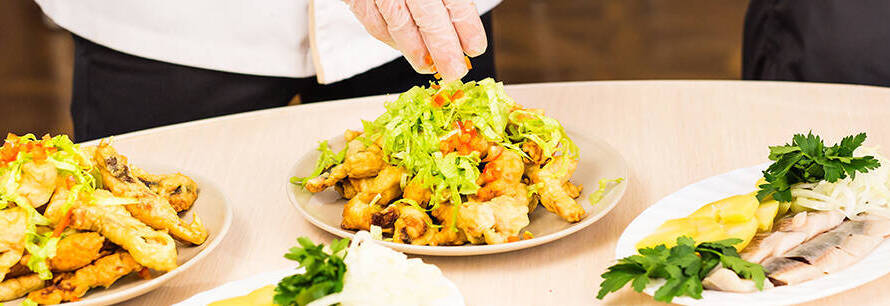 Live food counters with chef plating fresh dishes